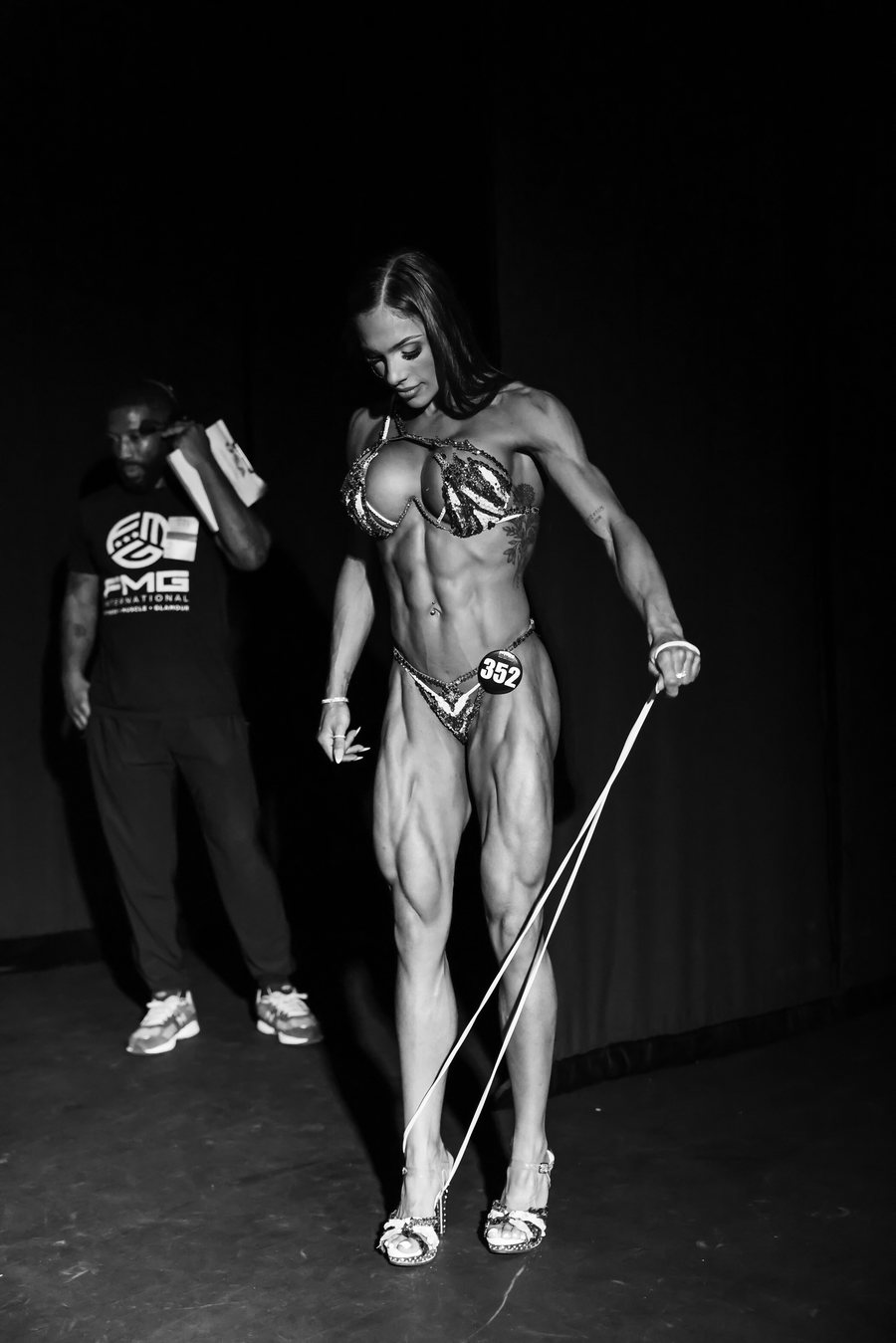 A competitor pumps up with a band in the backstage warm-up area